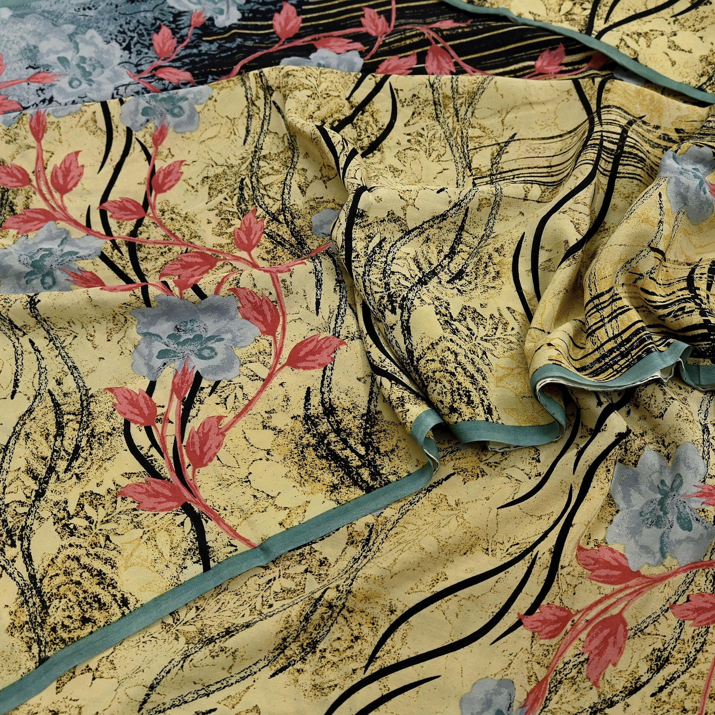 Decorative silk fabric with floral and abstract patterns on a textured background