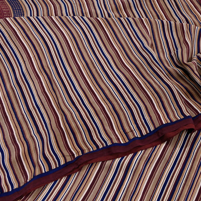 Close-up of striped fabric with brown, blue, and red colors.