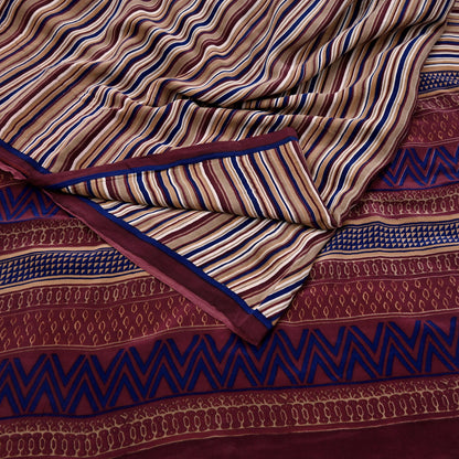 Close-up of patterned fabric with blue, brown, and beige colors.