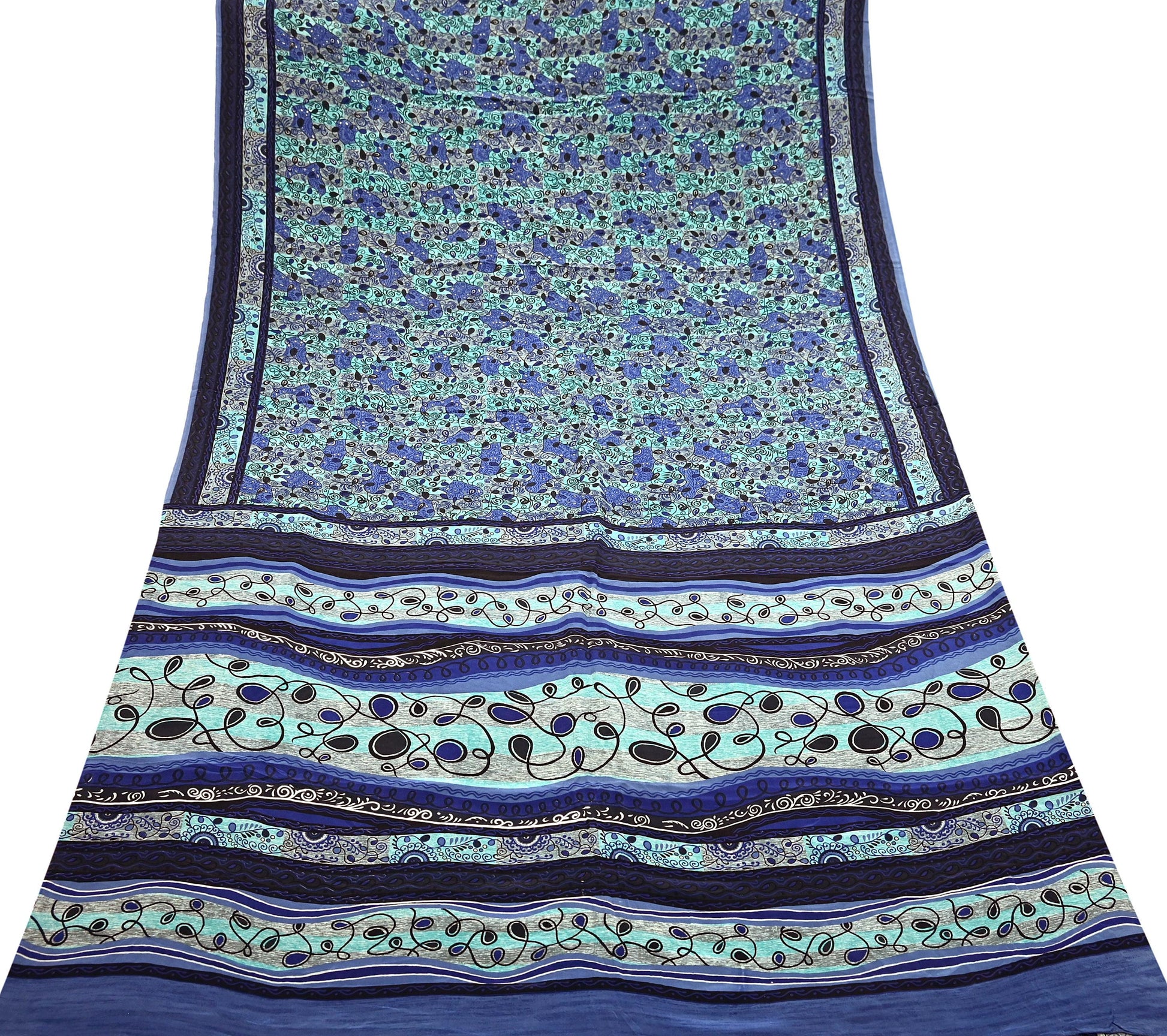 Blue and green patterned pure crepe silk saree fabric with stripes and floral designs on a white background