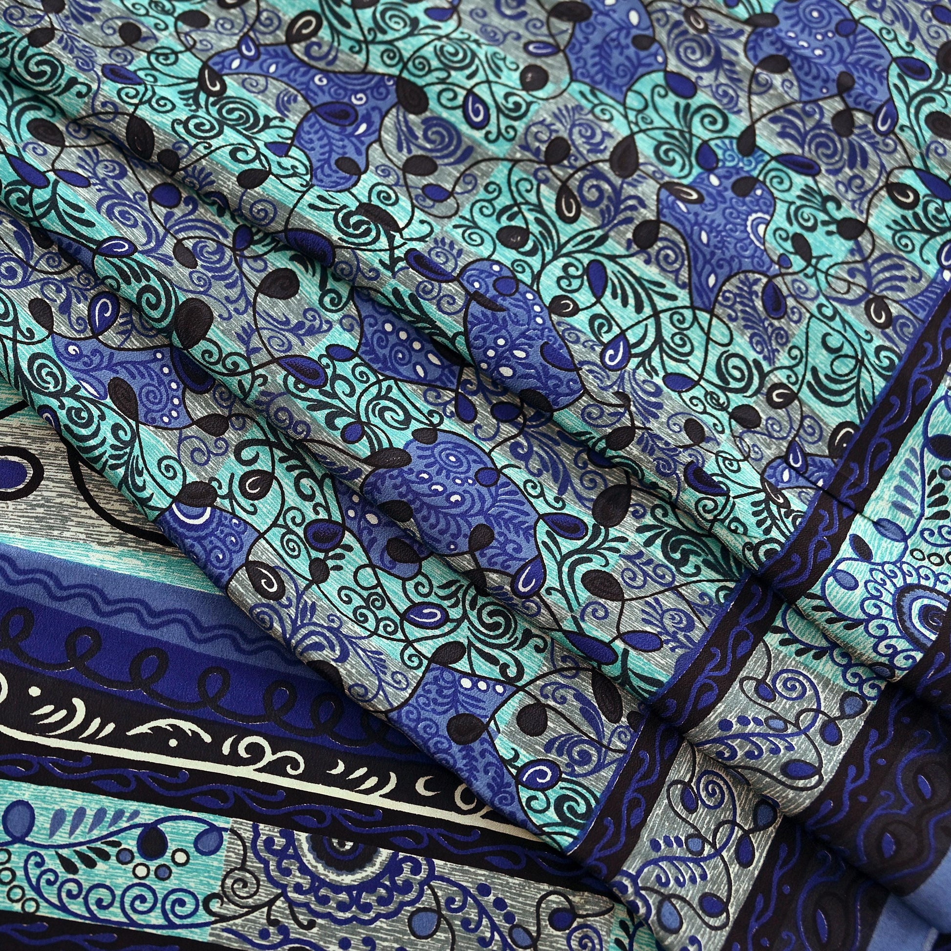 Patterned pure crepe silk saree fabric with blue and green design